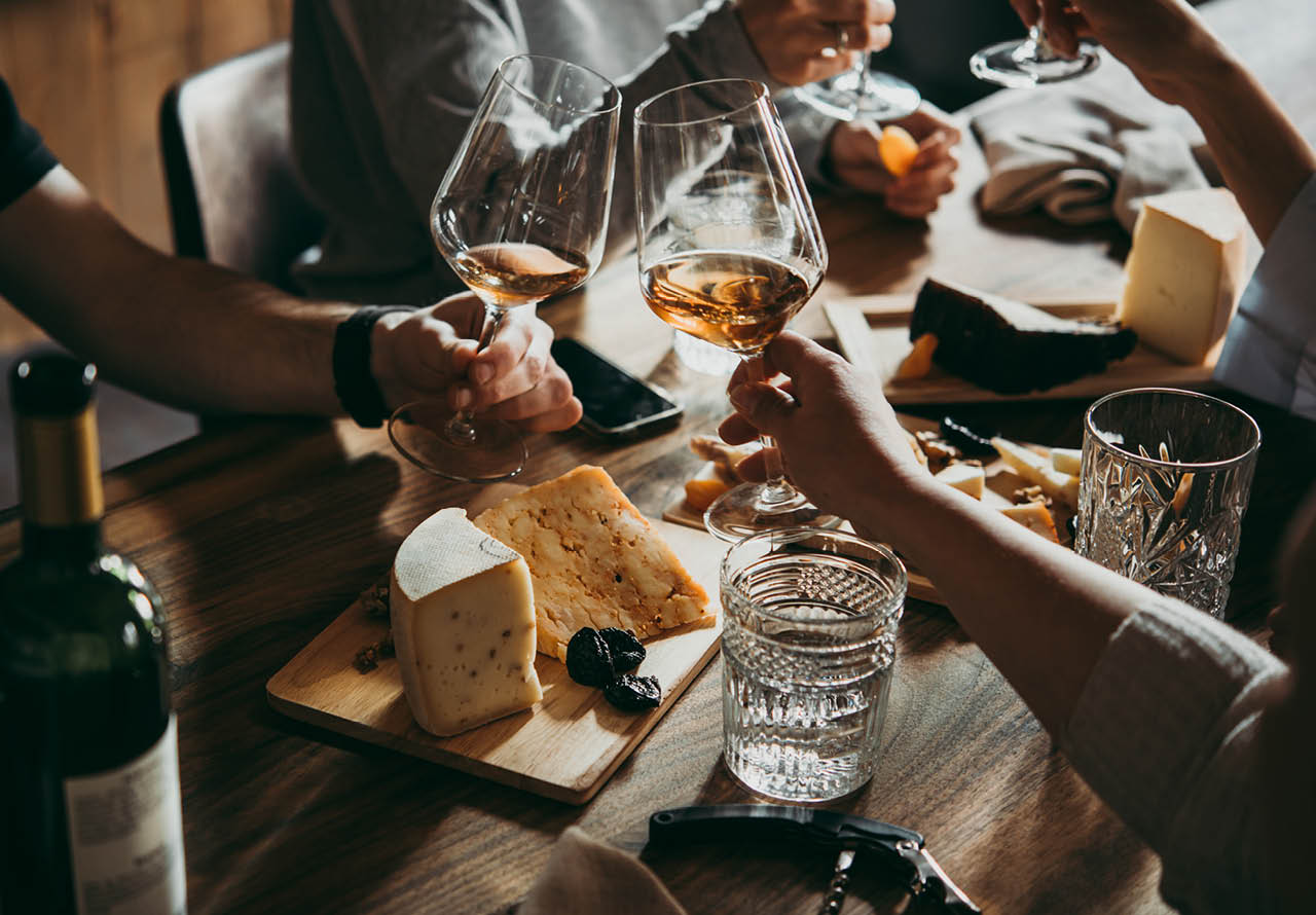 Wine and cheese served for a friendly party in a bar or a restaurant.